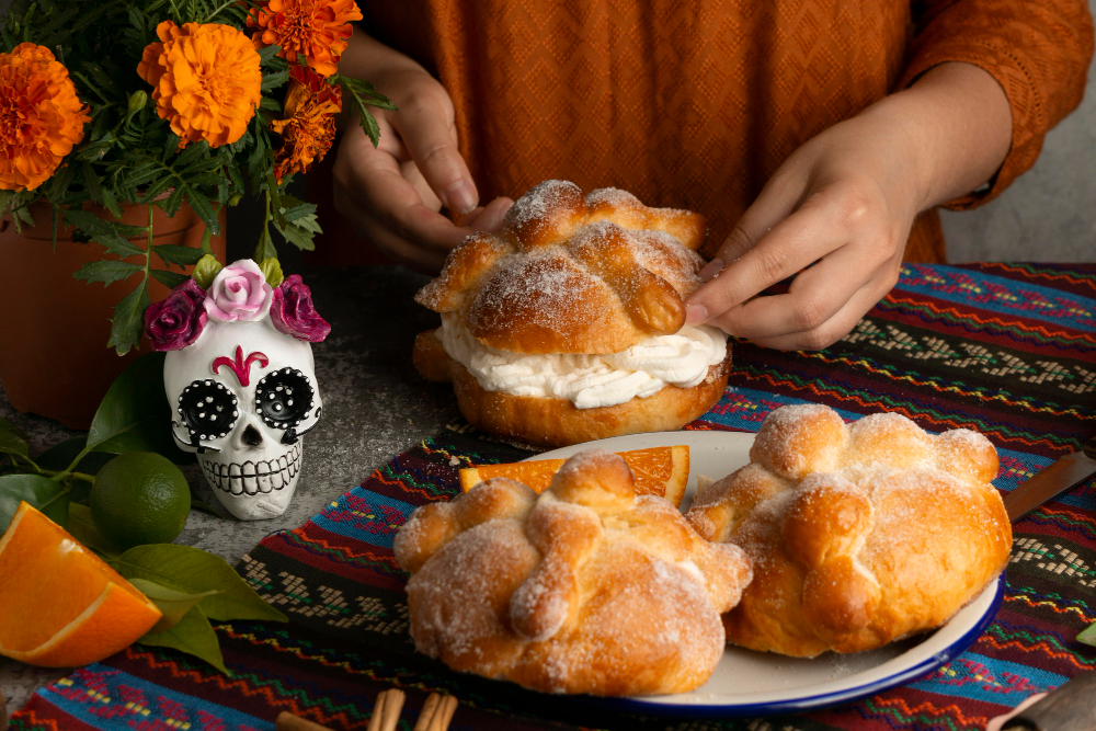 high angle woman making pan de muerto