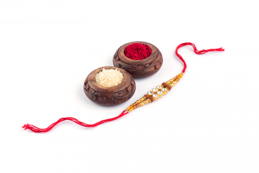 raksha bandhan with elegant rakhi rice grains kumkum traditional indian wrist band which is symbol love brothers sisters